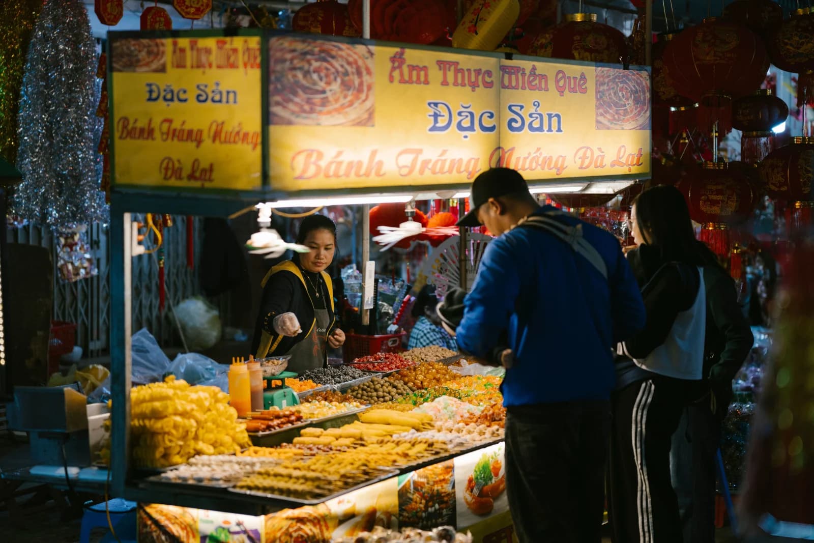 Vietnamese night-market food stall with local snacks