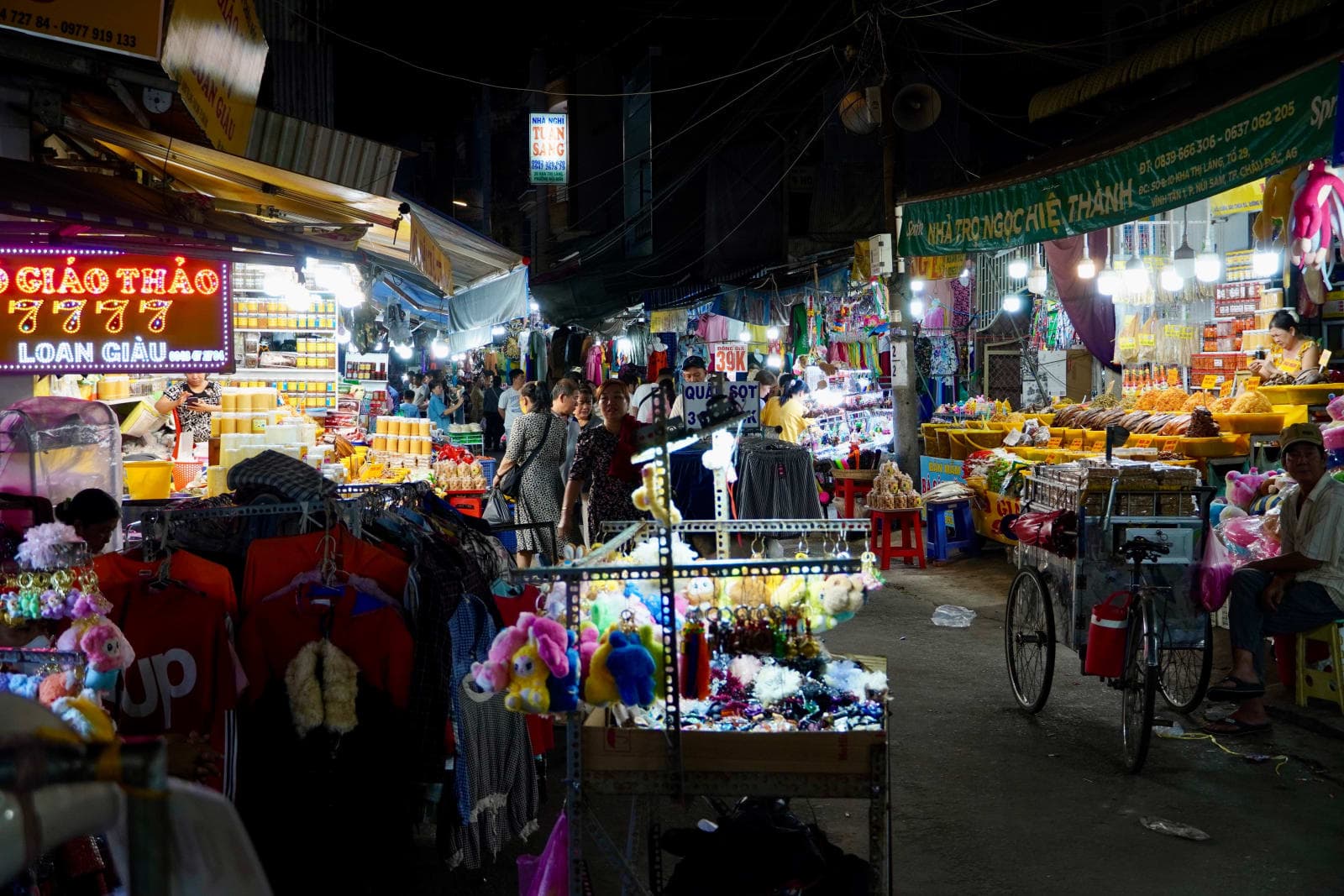 Night-market stalls and shoppers in Vietnam